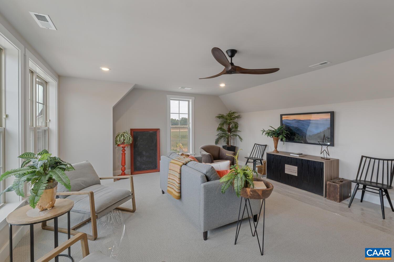 4 Jarmans Gap Road, Unit LOT 4 JARMANS GAP Crozet, VA 22932 - Photo 45 of 47 a living room with furniture a window and a flat screen tv