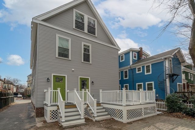a front view of a house with a fence