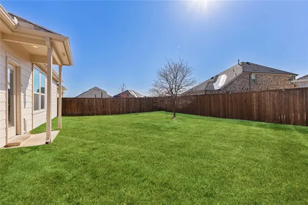 a view of an house with backyard and outdoor space