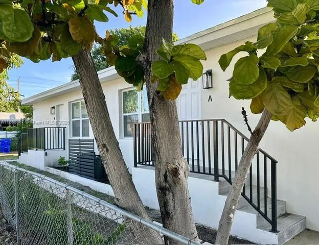 a view of entryway with wooden floor