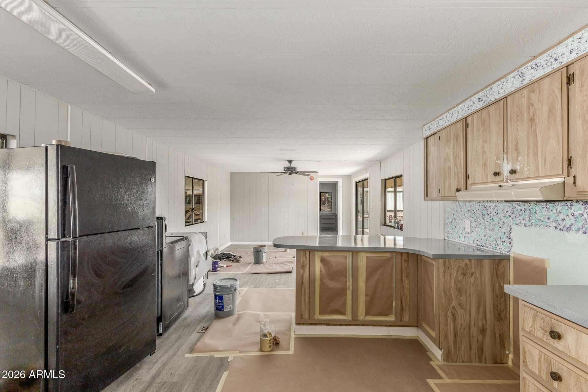 9302 East Broadway Road, Unit 155 Mesa, AZ 85208 - Photo 11 of 26 a kitchen with a sink appliances and cabinets