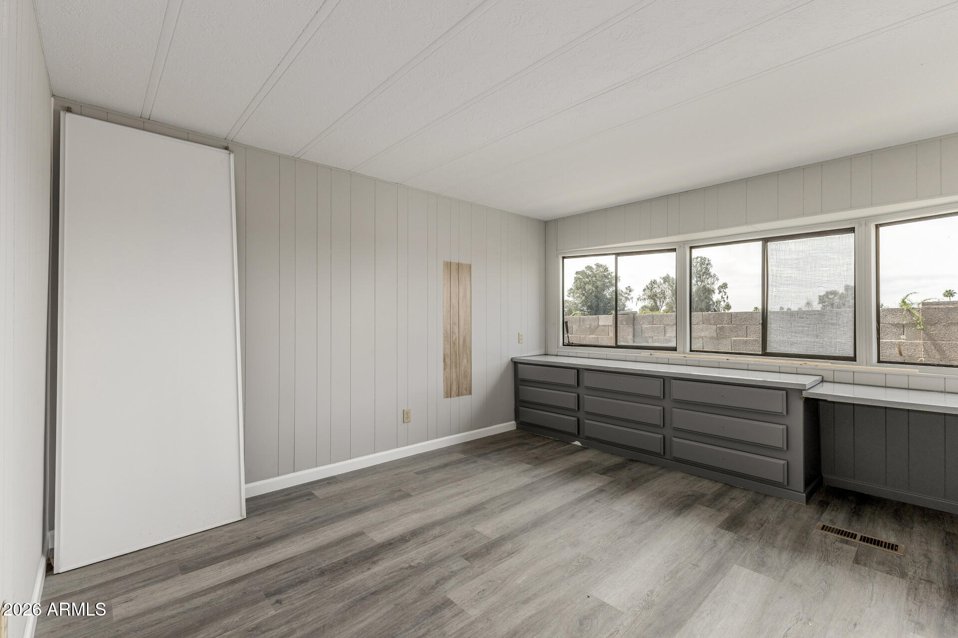 9302 East Broadway Road, Unit 155 Mesa, AZ 85208 - Photo 12 of 26 a area with wooden floor and walls