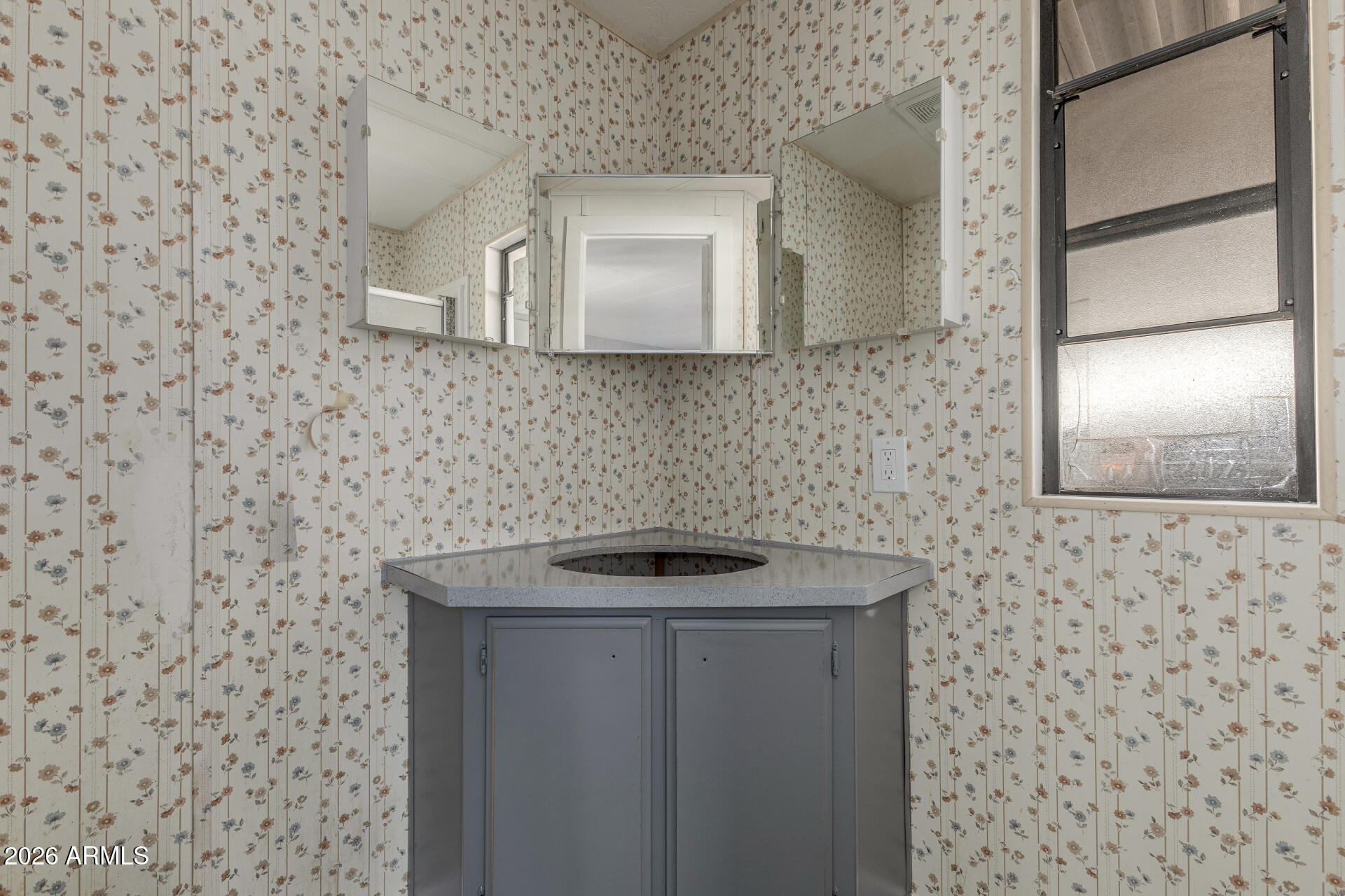 9302 East Broadway Road, Unit 155 Mesa, AZ 85208 - Photo 20 of 26 a bathroom with a sink and a mirror