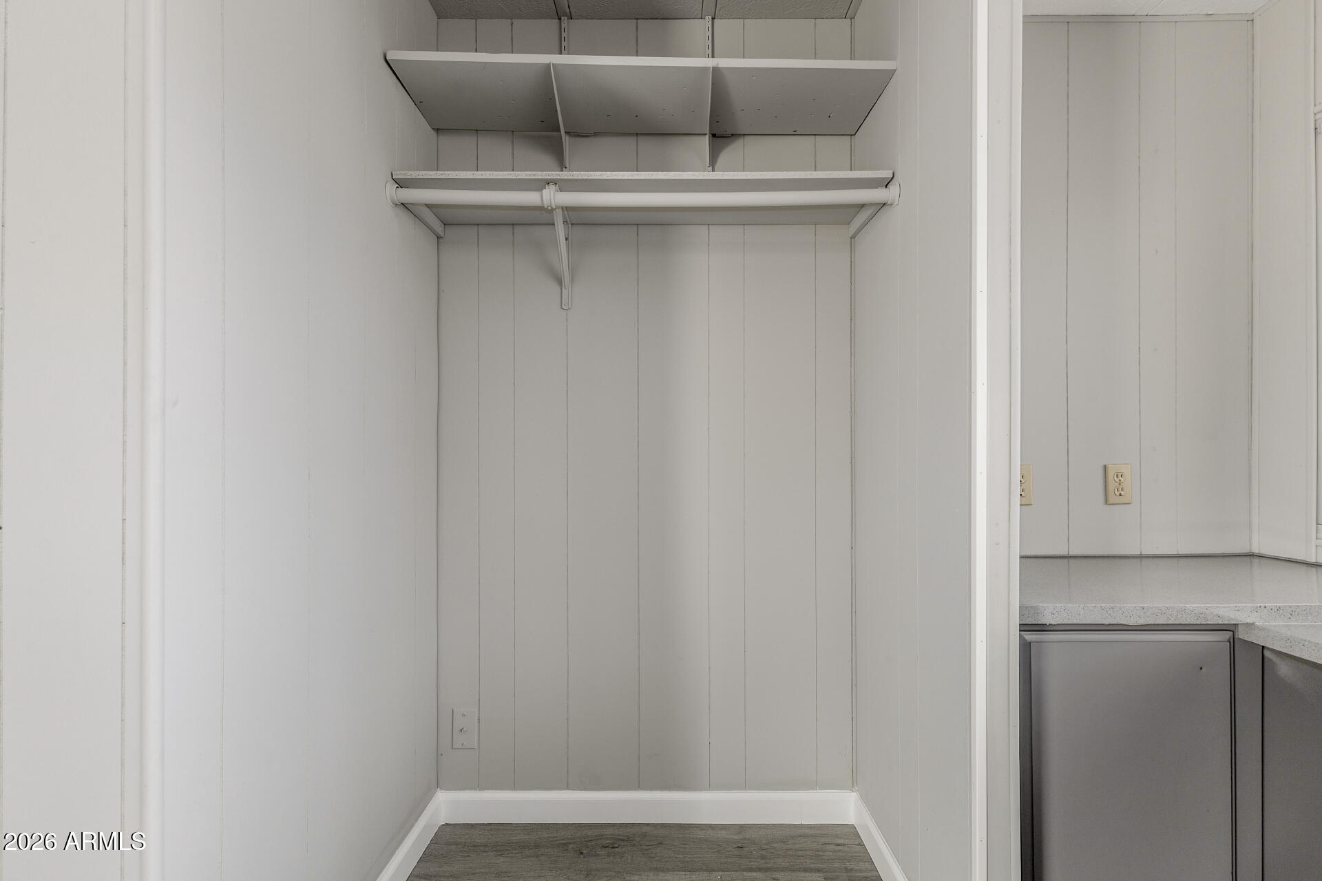 9302 East Broadway Road, Unit 155 Mesa, AZ 85208 - Photo 22 of 26 a view of walk in closet with empty racks