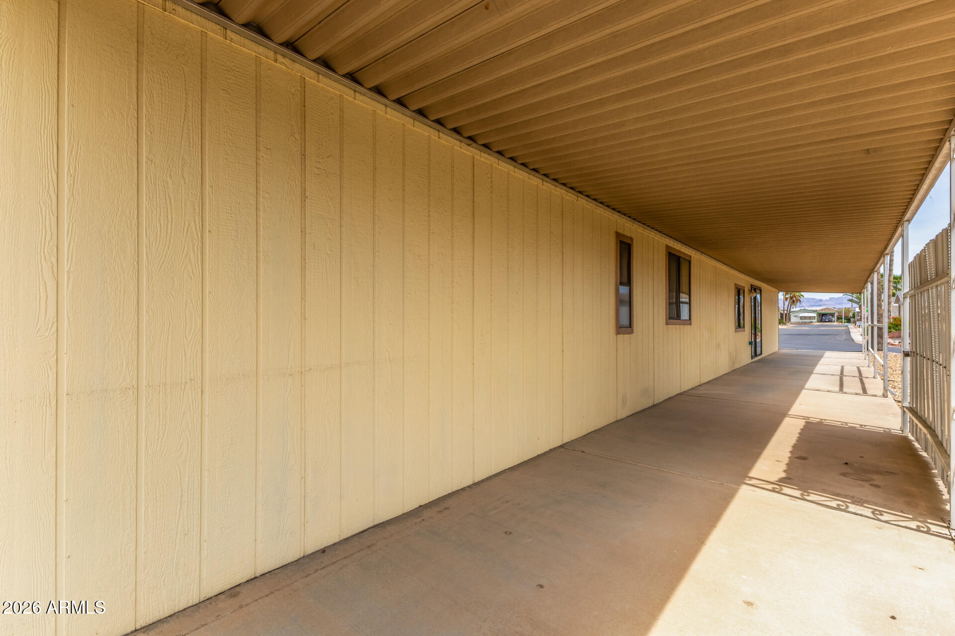 9302 East Broadway Road, Unit 155 Mesa, AZ 85208 - Photo 25 of 26 a view of a house with a street