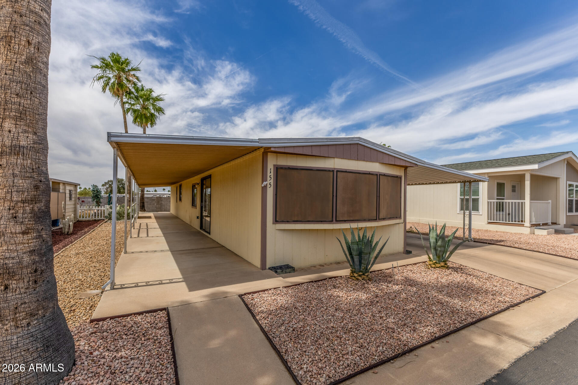 9302 East Broadway Road, Unit 155 Mesa, AZ 85208 - Photo 3 of 26 a living room with table