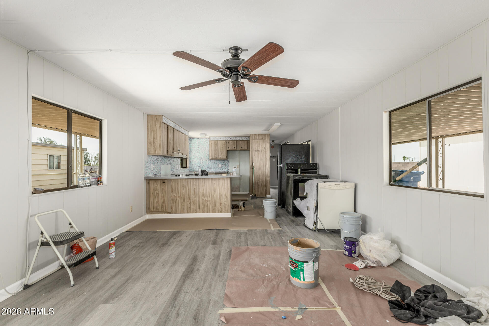 9302 East Broadway Road, Unit 155 Mesa, AZ 85208 - Photo 6 of 26 a living room with furniture and a wooden floor