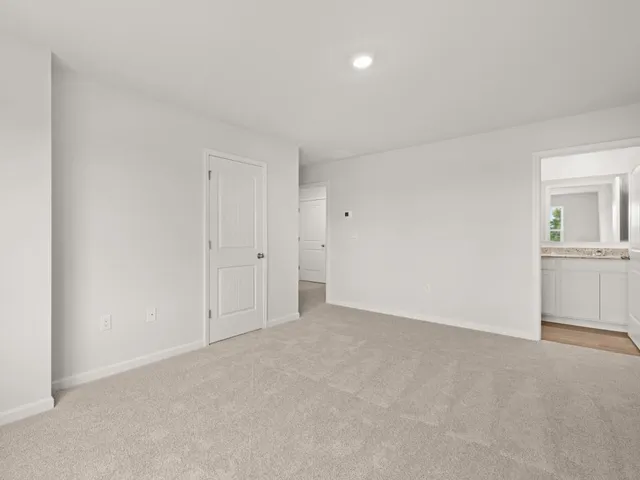 a bathroom with a double vanity sink and mirror