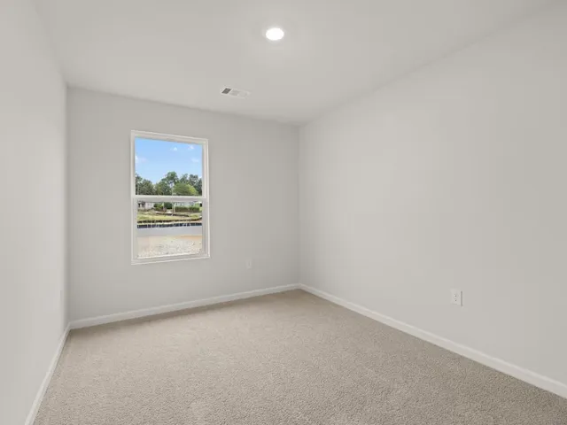 a view of a swimming pool with a yard