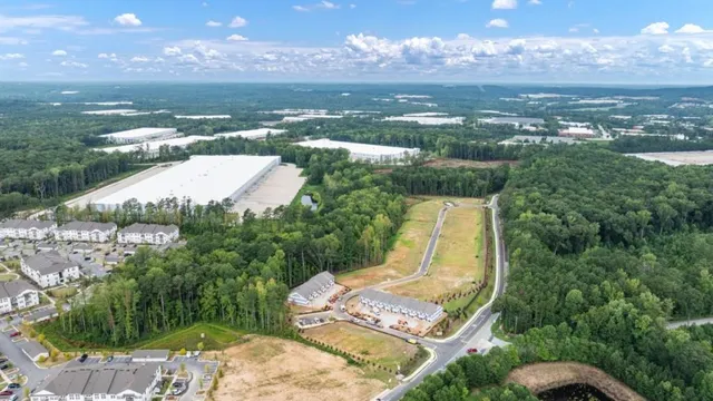 a view of a garden with a building in the background