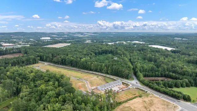 a view of house with outdoor space and sitting area
