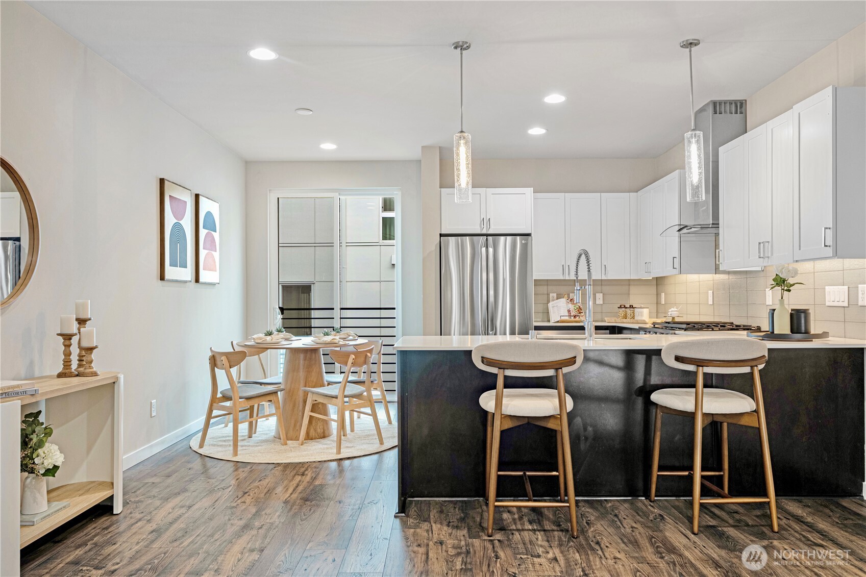 8554 22nd Place Northeast Seattle, WA 98115 - Photo 12 of 35 a view of a dining room with furniture and wooden floor