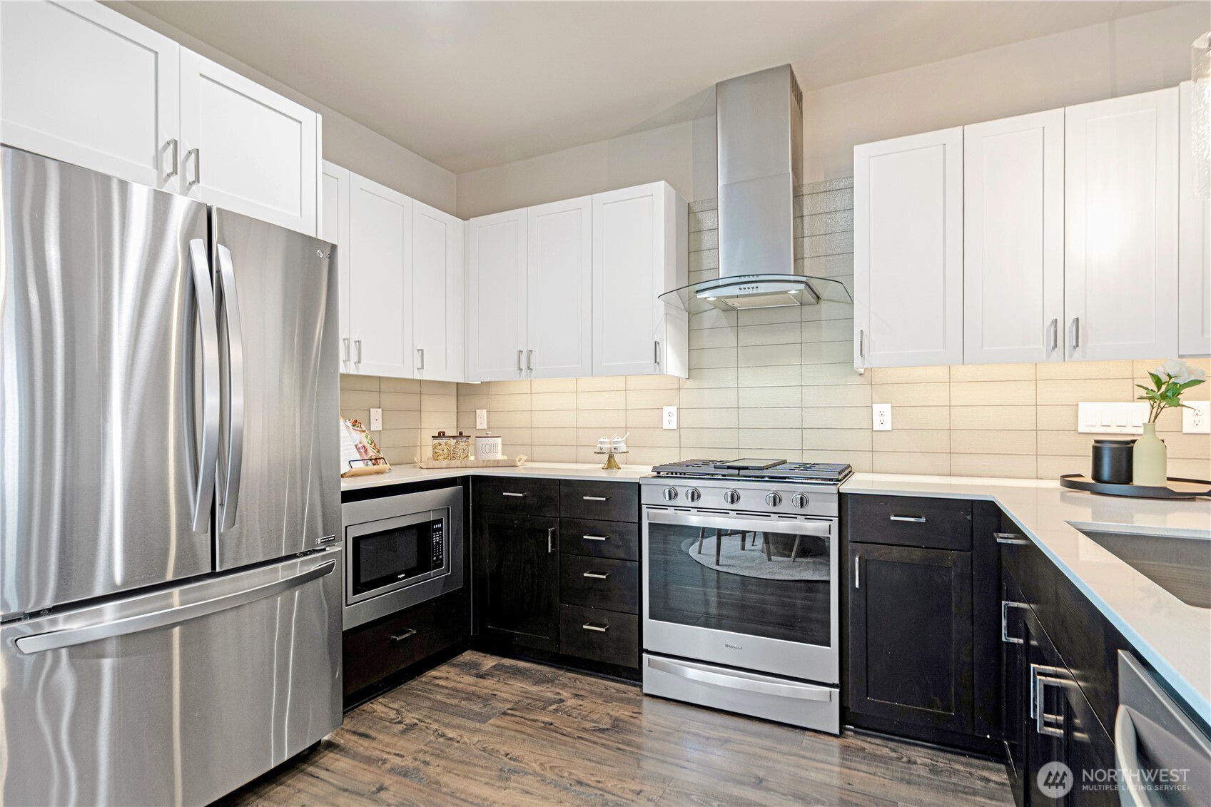 8554 22nd Place Northeast Seattle, WA 98115 - Photo 14 of 35 a kitchen with stainless steel appliances granite countertop a stove and a refrigerator