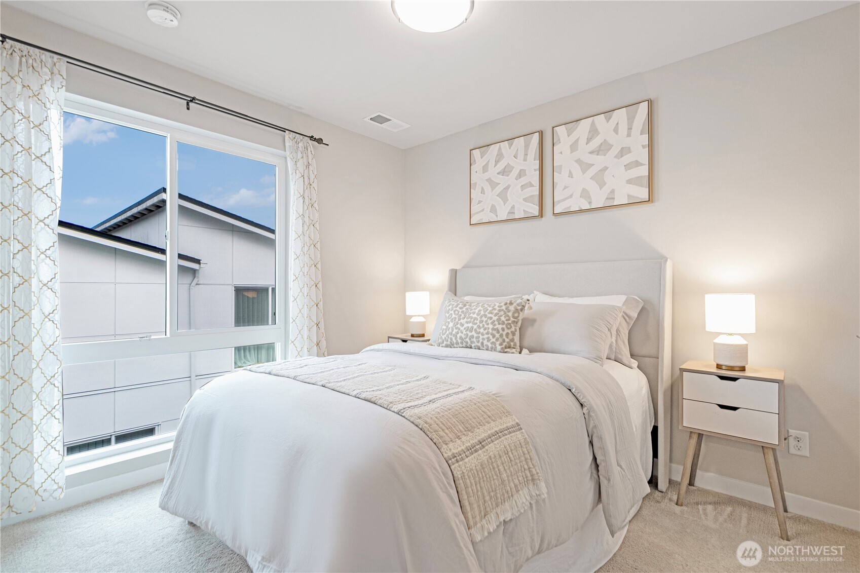 8554 22nd Place Northeast Seattle, WA 98115 - Photo 21 of 35 a bedroom with a bed and a window
