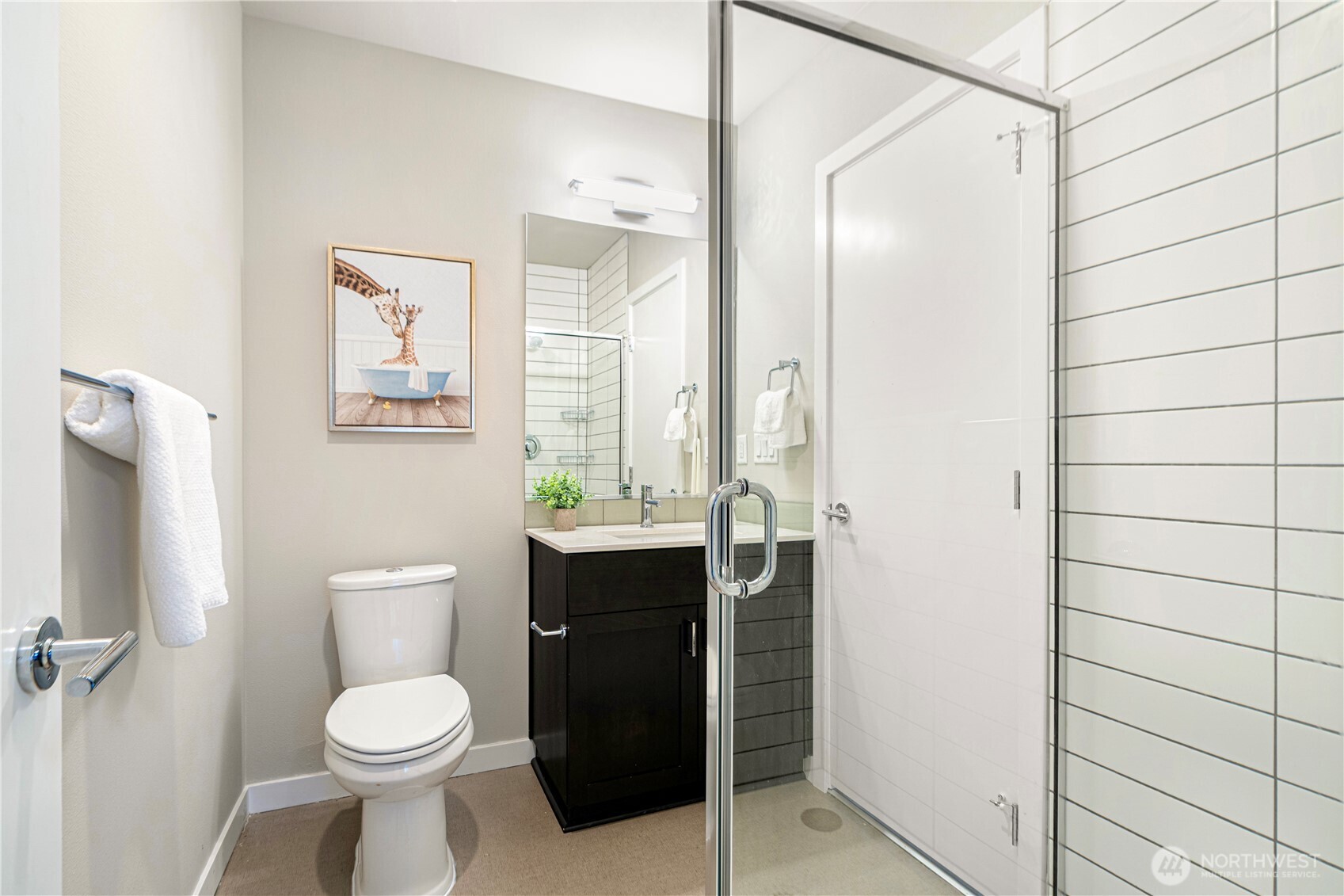 8554 22nd Place Northeast Seattle, WA 98115 - Photo 24 of 35 a bathroom with a toilet a sink and shower