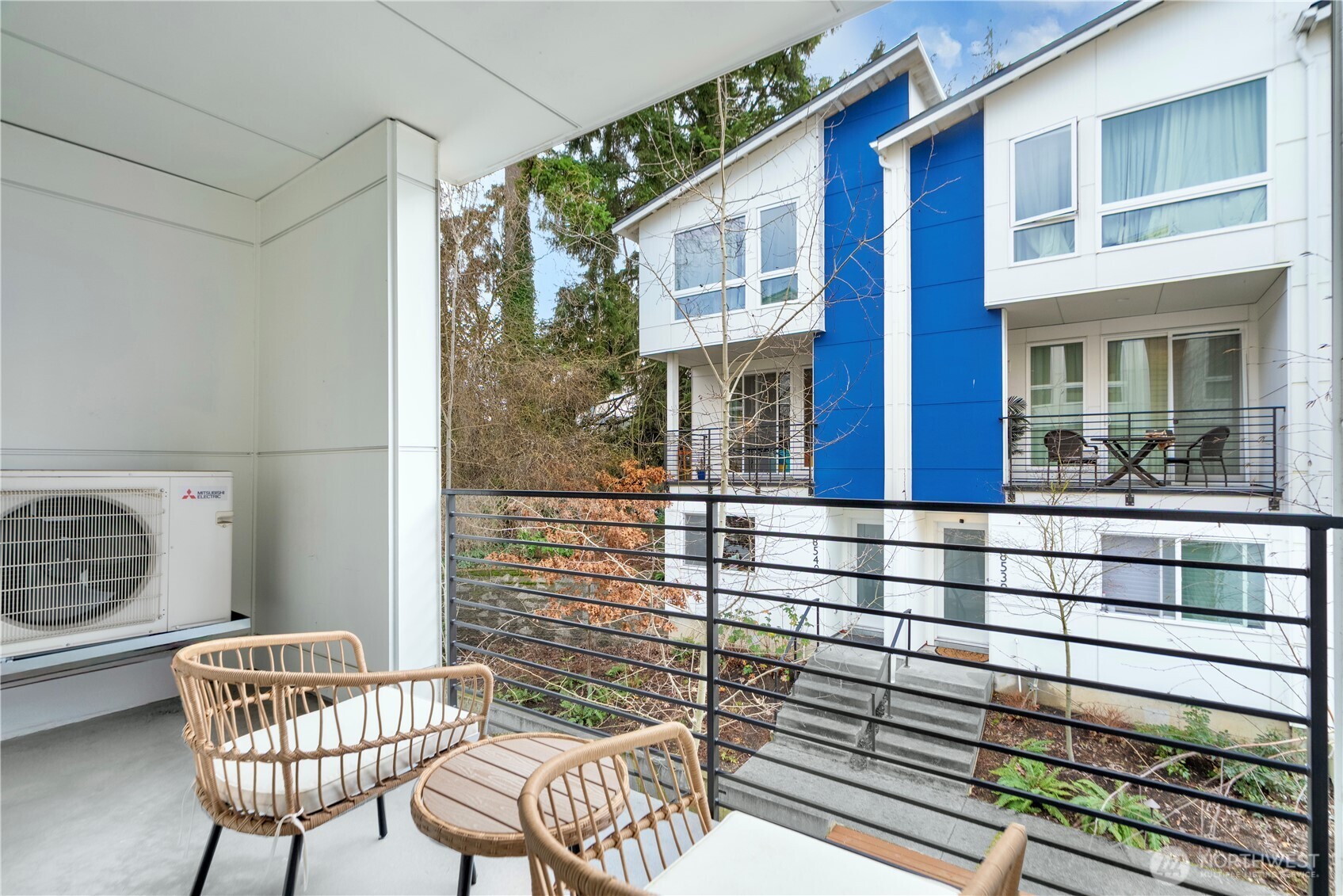 8554 22nd Place Northeast Seattle, WA 98115 - Photo 27 of 35 a view of a chair and table in the balcony