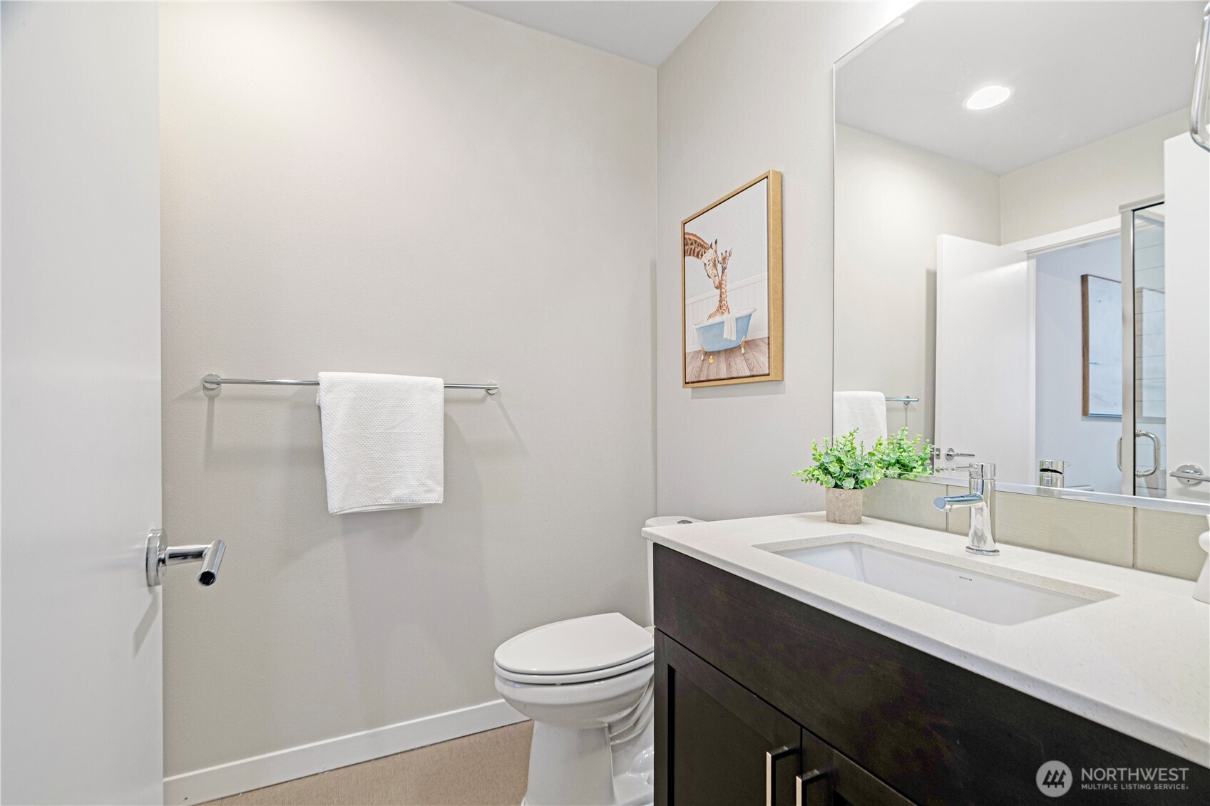 8554 22nd Place Northeast Seattle, WA 98115 - Photo 5 of 35 a bathroom with a sink a toilet and mirror