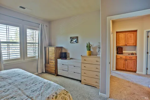 a bedroom with a bed and a dresser