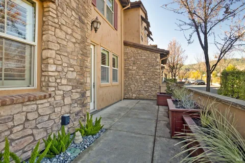 a view of a chair and table in the balcony