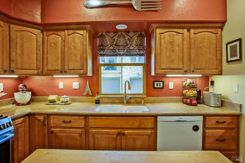 a kitchen with a sink and cabinets