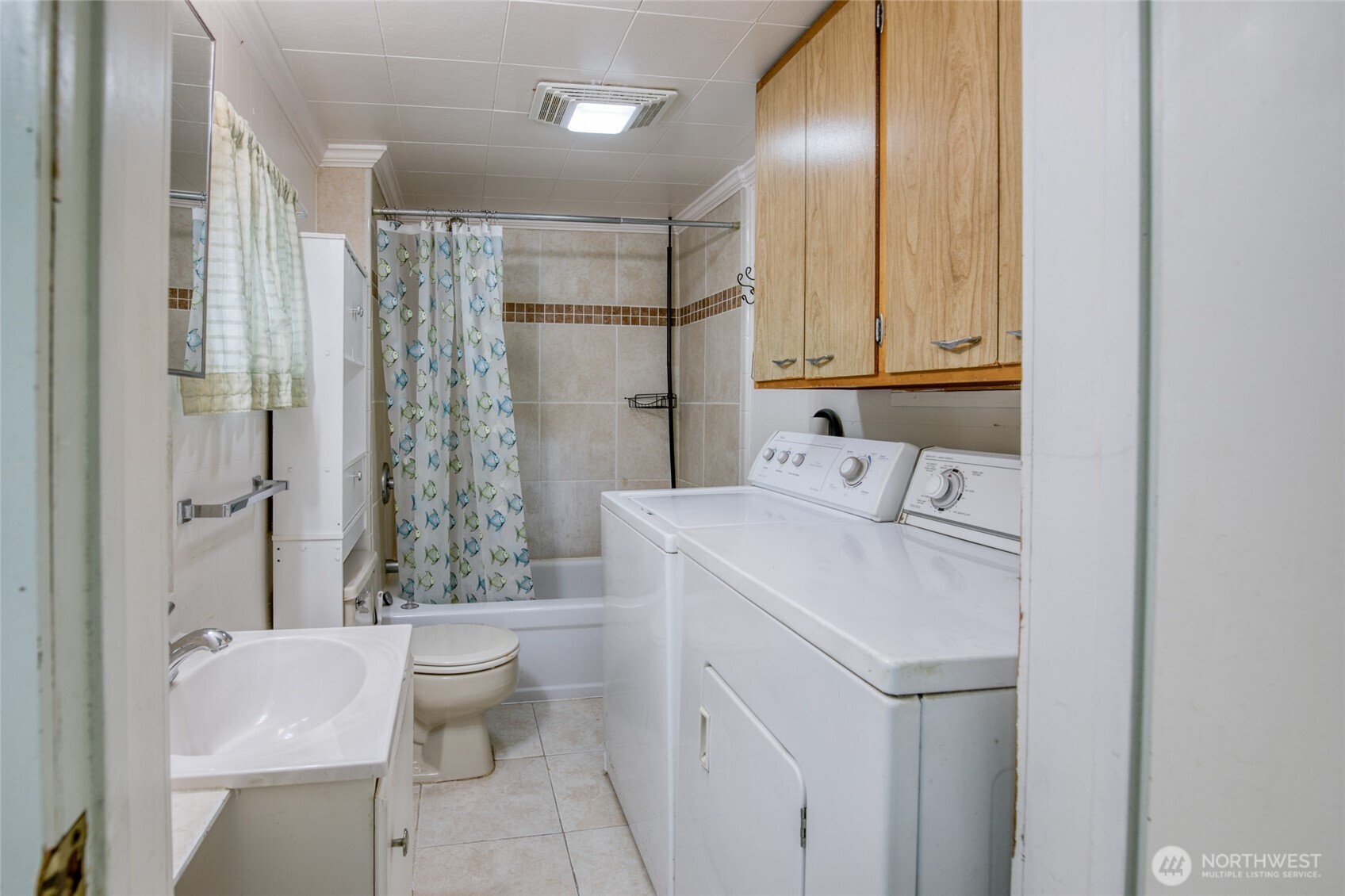 1019 Maple Street Hoquiam, WA 98550 - Photo 13 of 21 a bathroom with a sink toilet and shower
