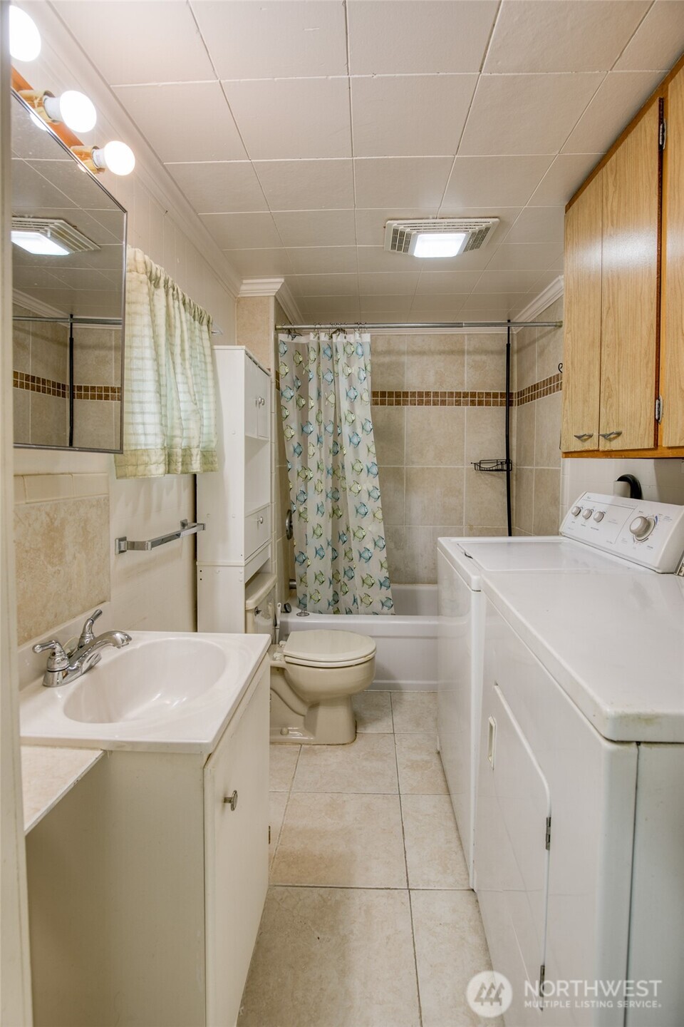 1019 Maple Street Hoquiam, WA 98550 - Photo 14 of 21 a bathroom with a sink a toilet and shower