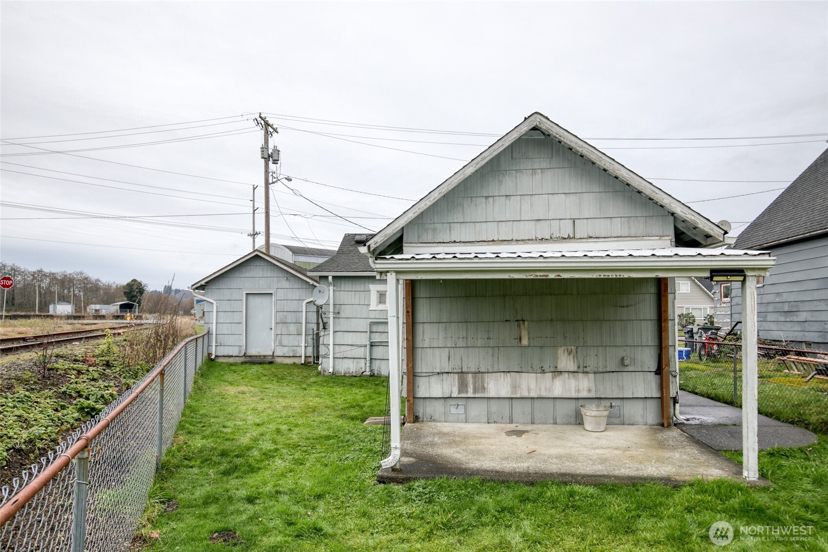 1019 Maple Street Hoquiam, WA 98550 - Photo 20 of 21 a view of a house with a wooden deck and a yard