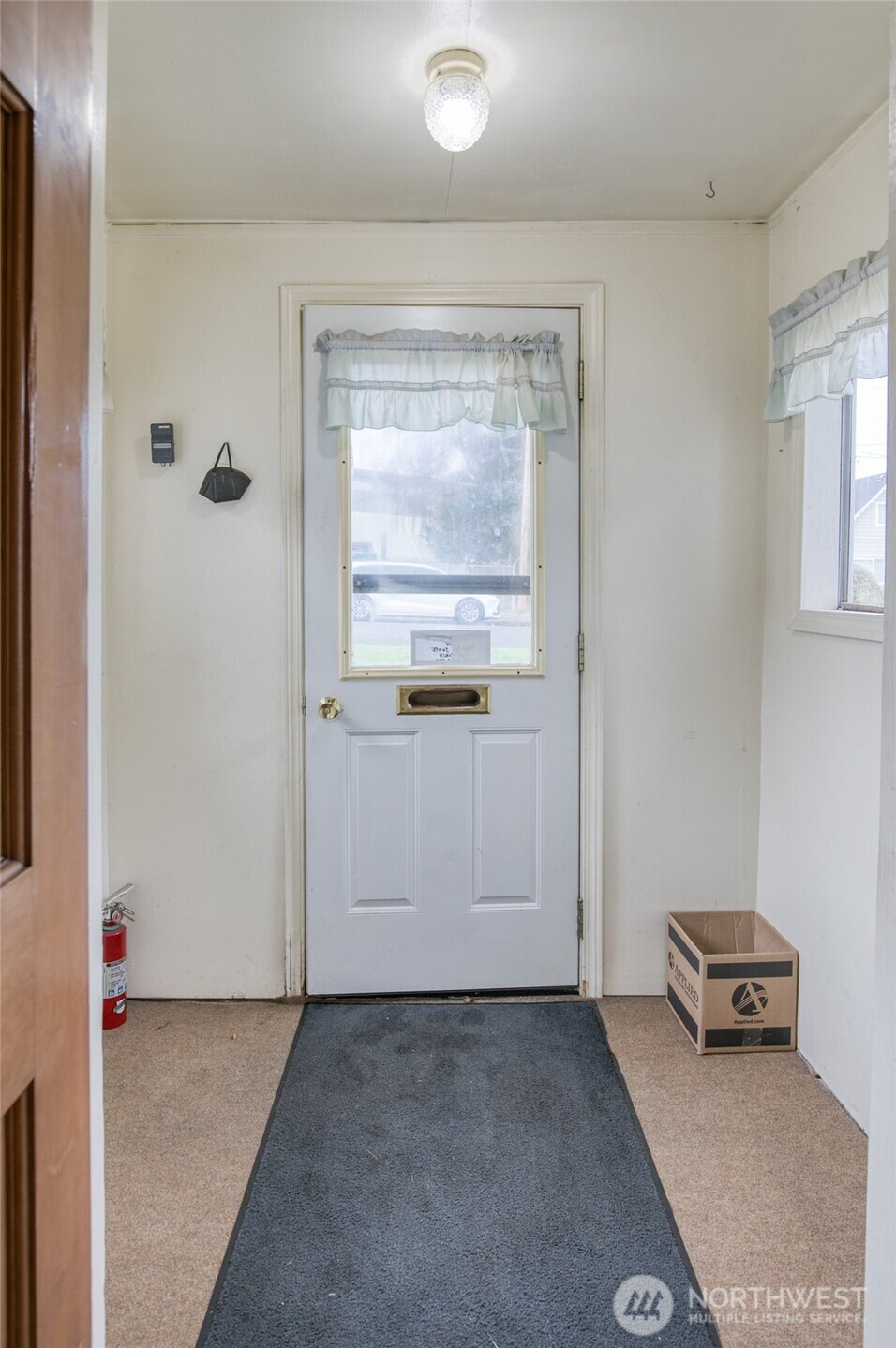 1019 Maple Street Hoquiam, WA 98550 - Photo 2 of 21 a view of a livingroom with an empty space and a window