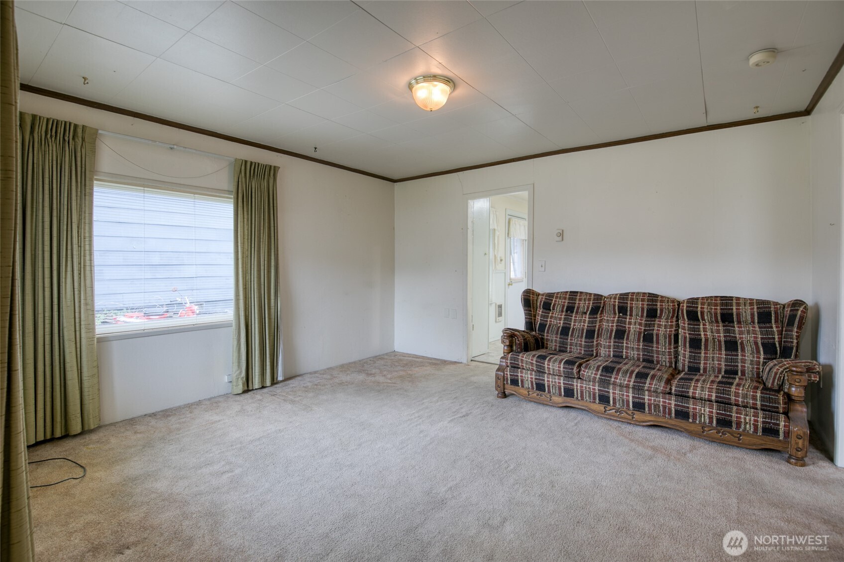 1019 Maple Street Hoquiam, WA 98550 - Photo 3 of 21 a view of an empty room with a window
