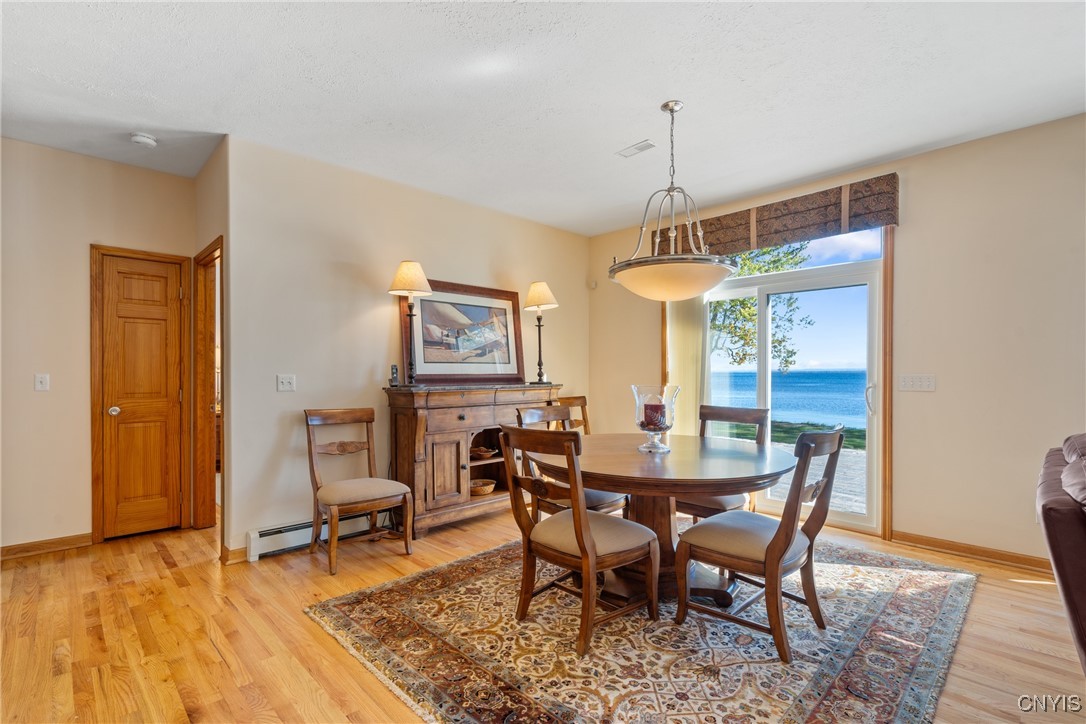 235 Highway 49 Constantia, NY 13042 - Photo 14 of 46 The sliding glass door just beyond the table gives