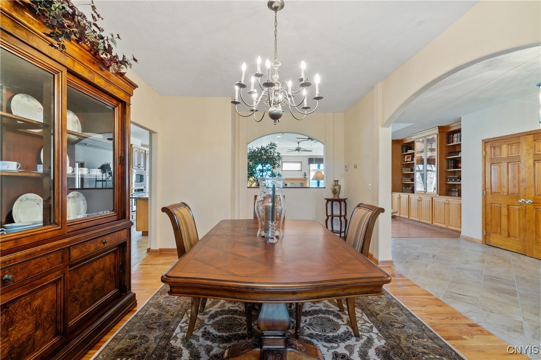 235 Highway 49 Constantia, NY 13042 - Photo 22 of 46 At the far end of the dining room is an arched pas