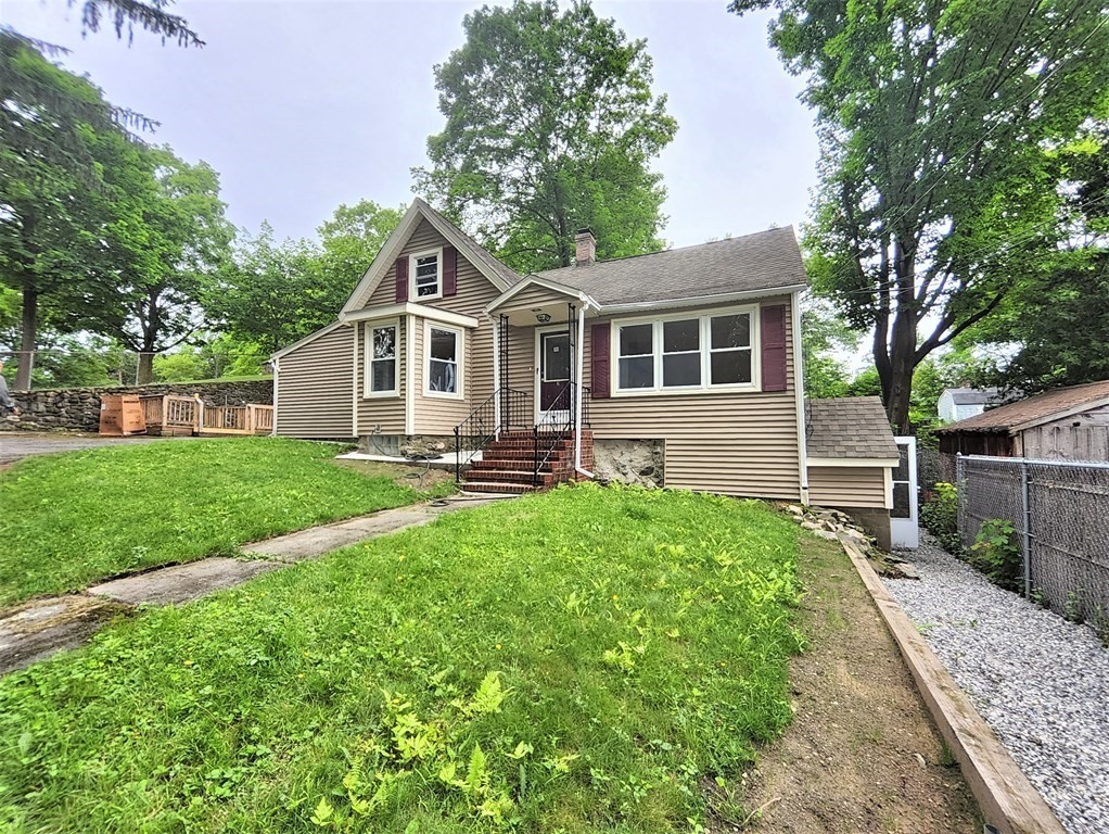 2 Grove Street Methuen, MA 01844 - Photo 1 of 15 a front view of house with yard and green space