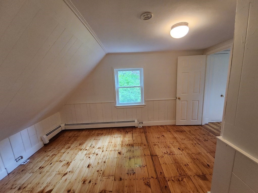 2 Grove Street Methuen, MA 01844 - Photo 11 of 15 an empty room with wooden floor and windows