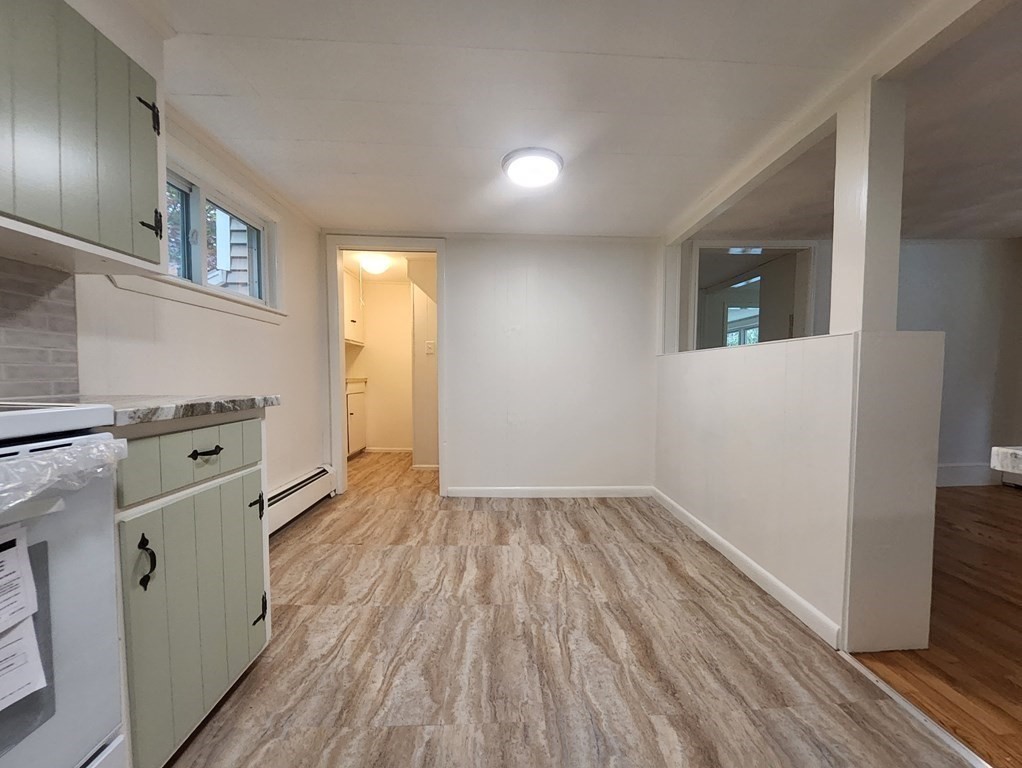2 Grove Street Methuen, MA 01844 - Photo 13 of 15 wooden floor in an empty room with a window