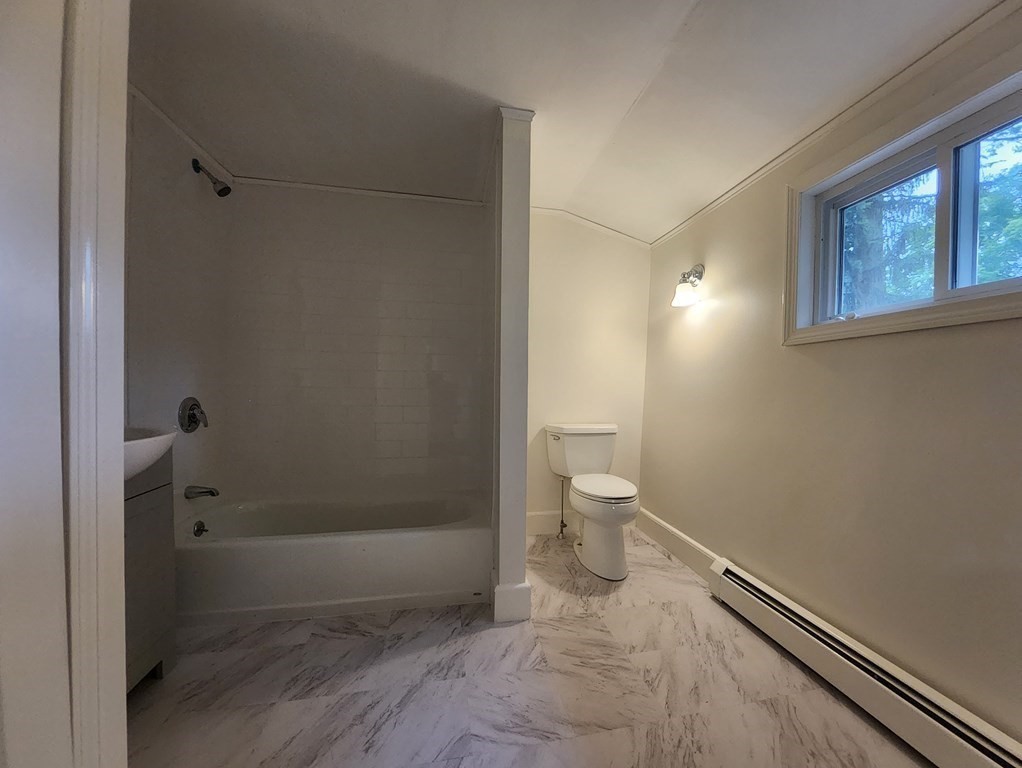 2 Grove Street Methuen, MA 01844 - Photo 14 of 15 a bathroom with a toilet and shower