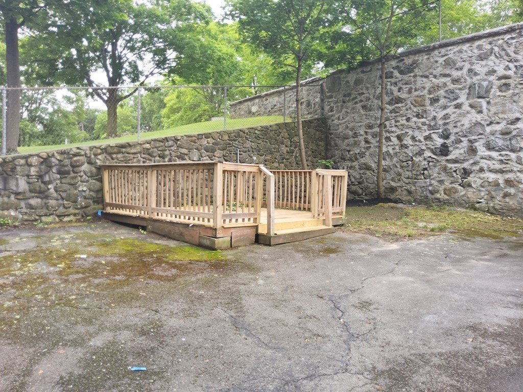 2 Grove Street Methuen, MA 01844 - Photo 3 of 15 a view of a yard with wooden fence