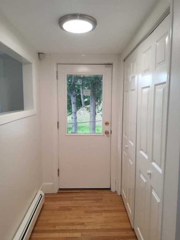 2 Grove Street Methuen, MA 01844 - Photo 5 of 15 a view of an empty room with wooden floor and a window