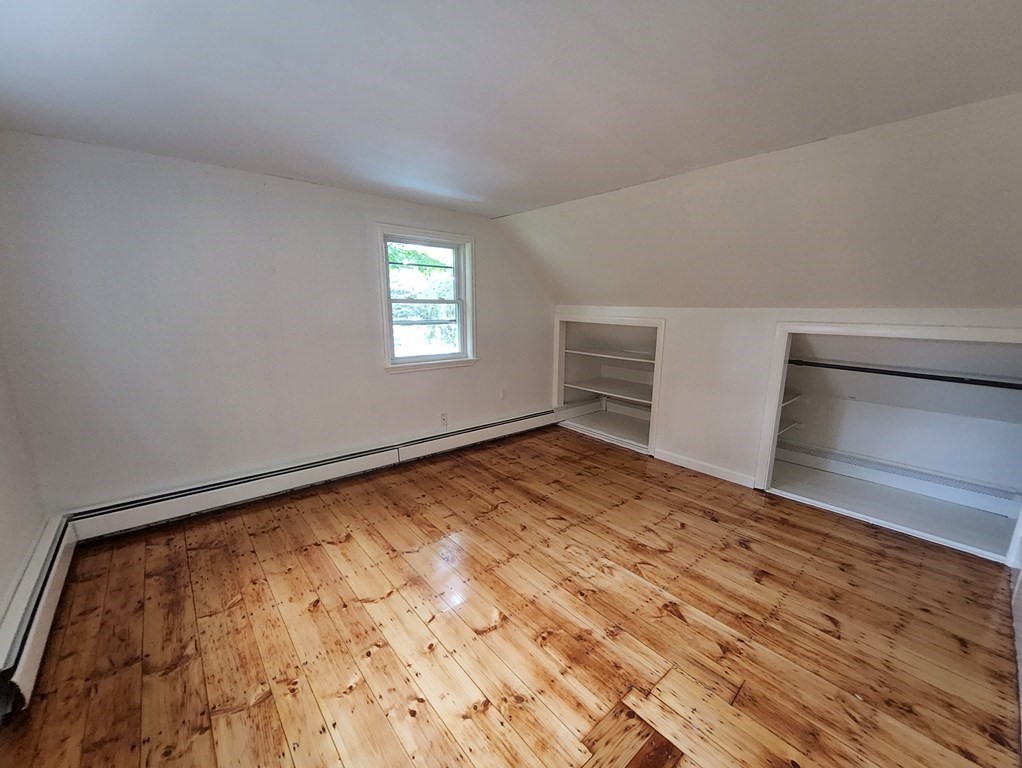 2 Grove Street Methuen, MA 01844 - Photo 8 of 15 a view of empty room with wooden floor and window