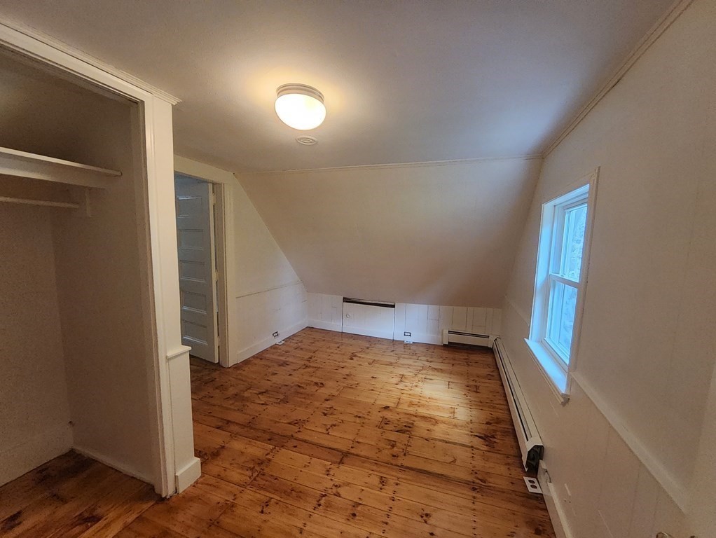 2 Grove Street Methuen, MA 01844 - Photo 9 of 15 a view of an empty room and wooden floor