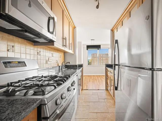 a kitchen with a stove and a refrigerator