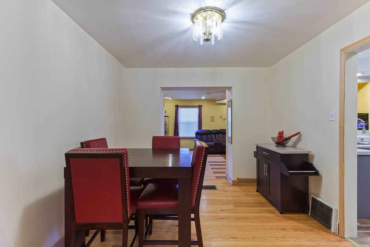 2544 East 91st Street Chicago, IL 60617 - Photo 8 of 37 a view of a dining room with furniture and wooden floor