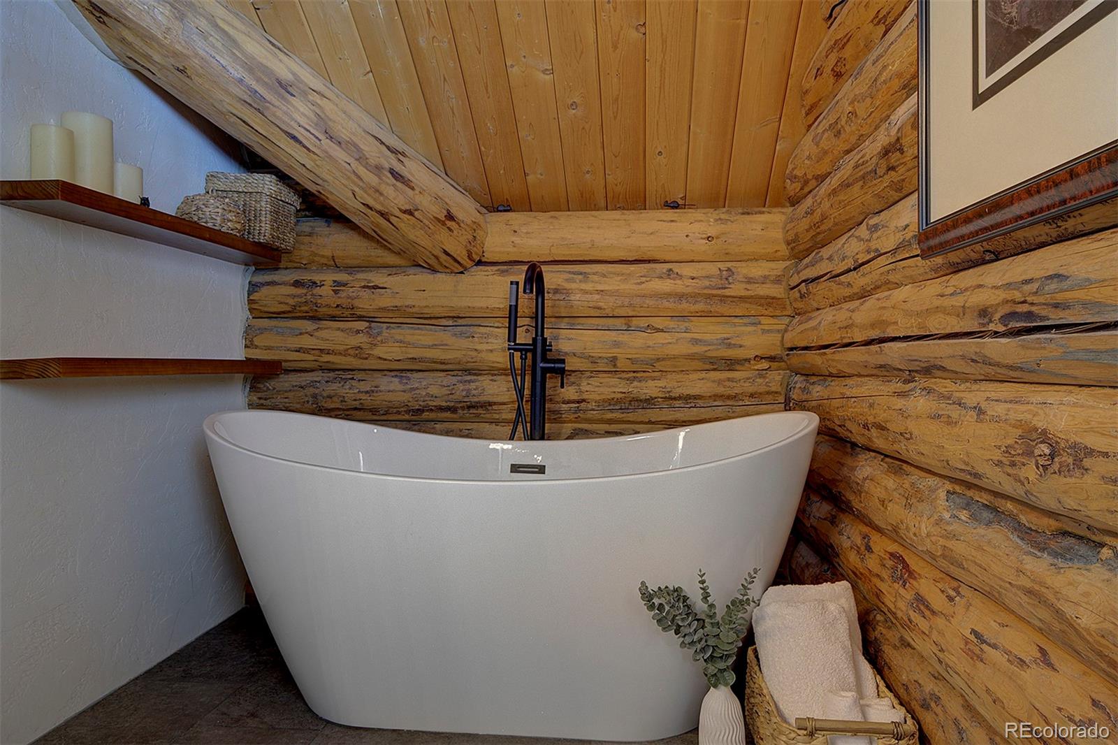 58 Conestoga Court Bailey, CO 80421 - Photo 18 of 37 a white bath tub sitting in a bathroom