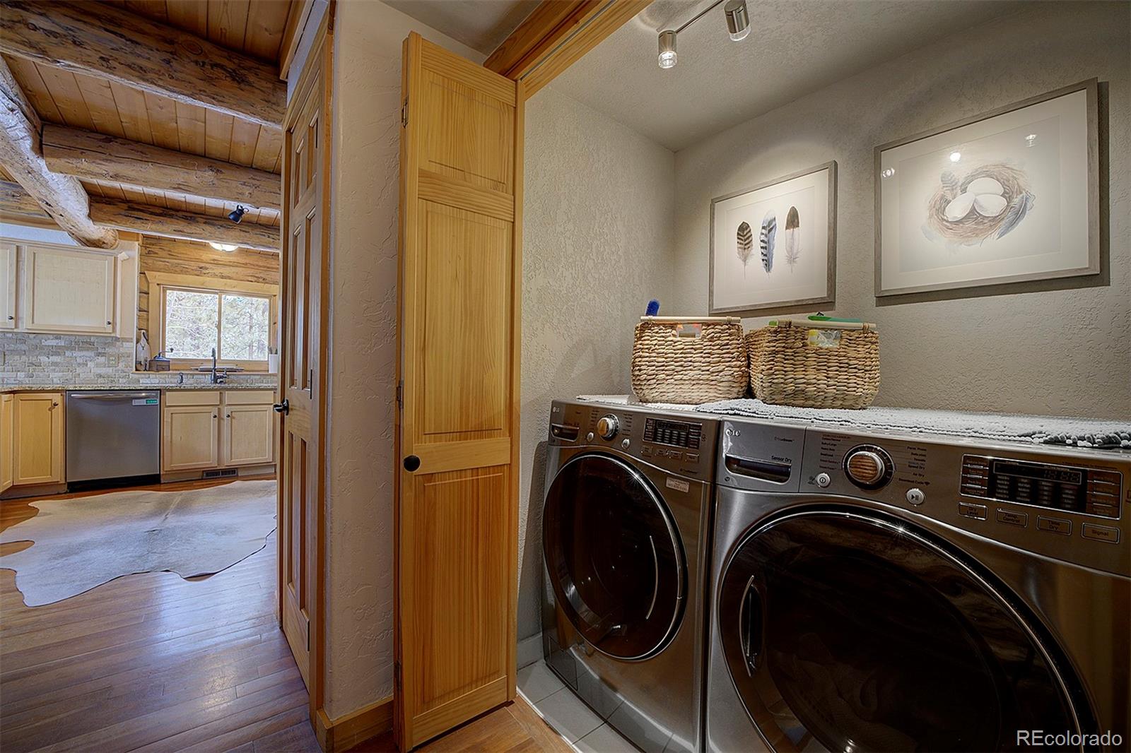 58 Conestoga Court Bailey, CO 80421 - Photo 27 of 37 a view of a storage and utility room with washer and dryer