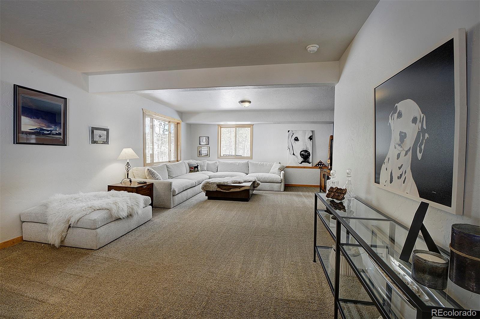 58 Conestoga Court Bailey, CO 80421 - Photo 28 of 37 a living room with furniture and a flat screen tv