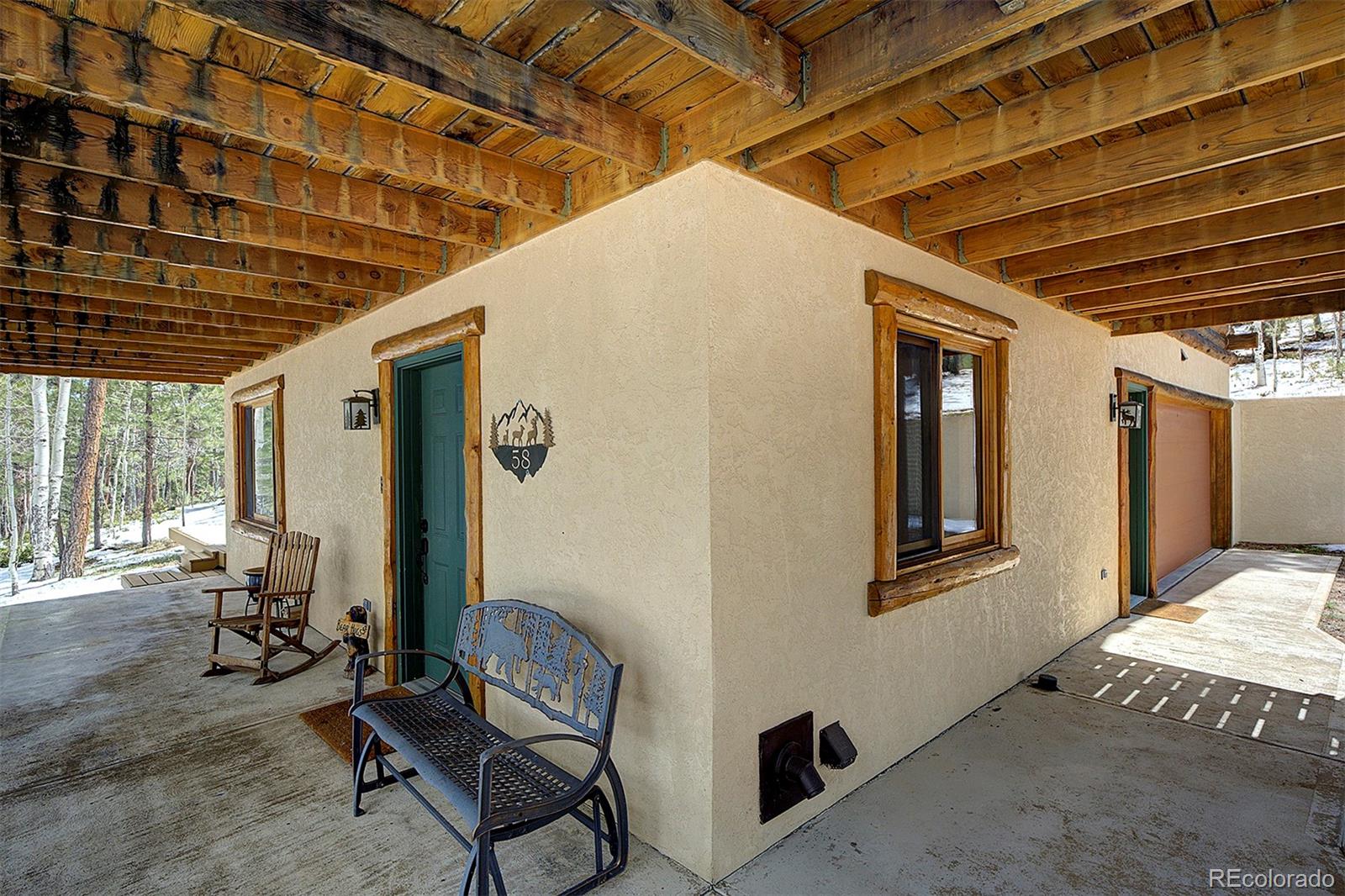 58 Conestoga Court Bailey, CO 80421 - Photo 31 of 37 a view of a room with chairs and a table