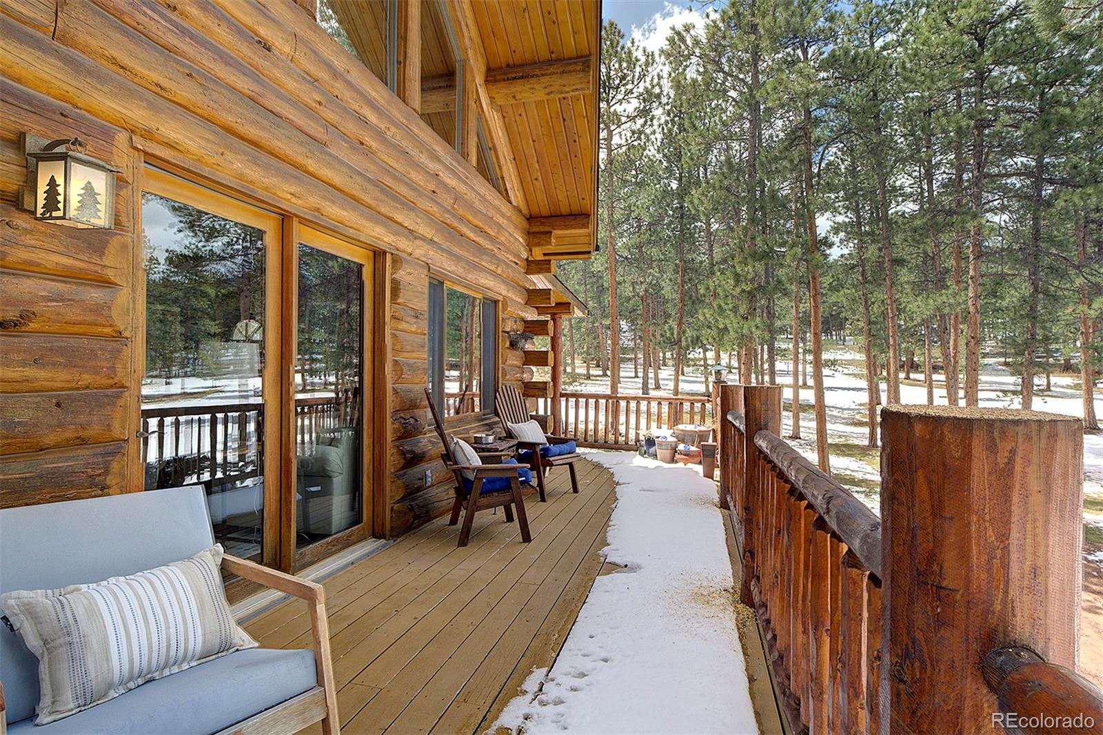 58 Conestoga Court Bailey, CO 80421 - Photo 33 of 37 a view of a patio with couches chairs and wooden floor