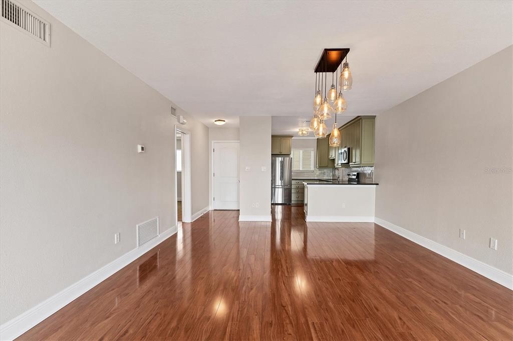 301 South Gulfstream Avenue, Unit 302 Sarasota, FL 34236 - Photo 11 of 25 a view of empty room with wooden floor