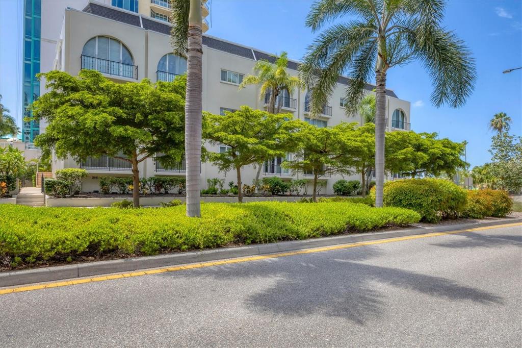301 South Gulfstream Avenue, Unit 302 Sarasota, FL 34236 - Photo 2 of 25 a front view of a house with a yard and plant