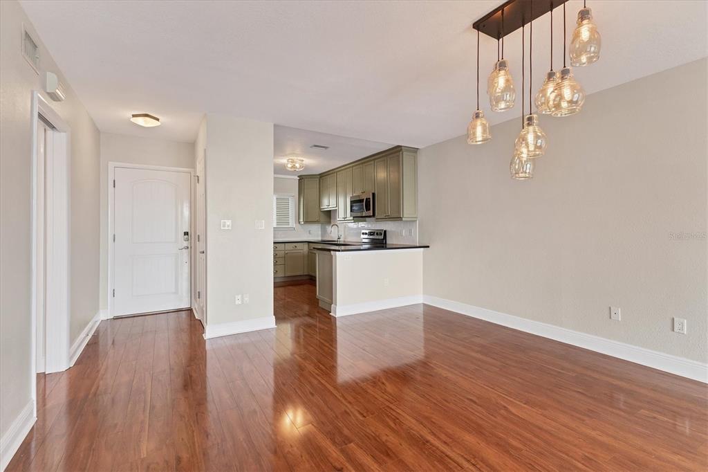301 South Gulfstream Avenue, Unit 302 Sarasota, FL 34236 - Photo 5 of 25 a view of kitchen with wooden floor