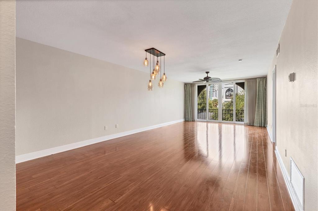 301 South Gulfstream Avenue, Unit 302 Sarasota, FL 34236 - Photo 6 of 25 a view of a room with wooden floor and floors